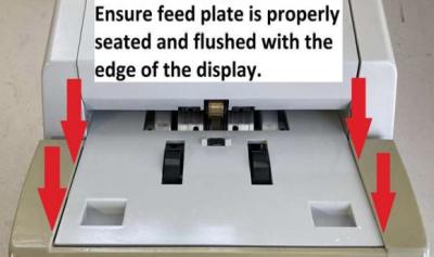 Ensure feed plate is properly seated and flush with the edge of the display